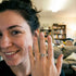 Person showing off a ring in a living room setting