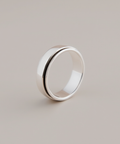 Silver ring on a light gray background