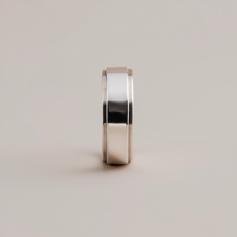 Silver ring on a light gray background