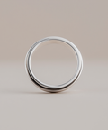 Silver ring on a beige background