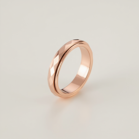 Rose gold ring on a light gray background