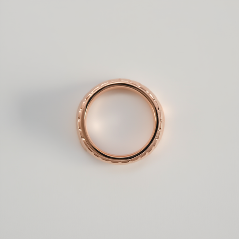 Rose gold ring on a light gray background