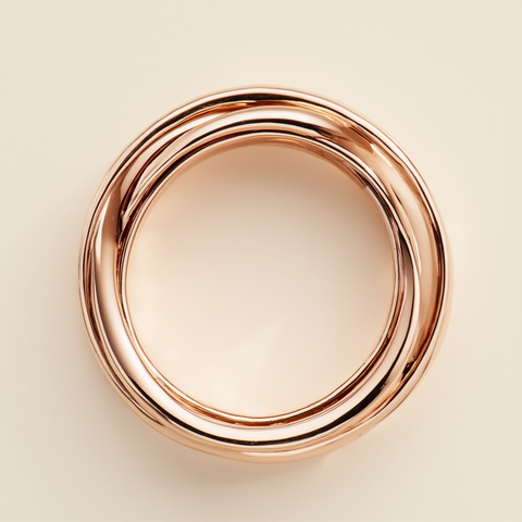 Rose gold ring on a beige background
