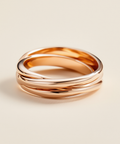 Rose gold ring on a beige background