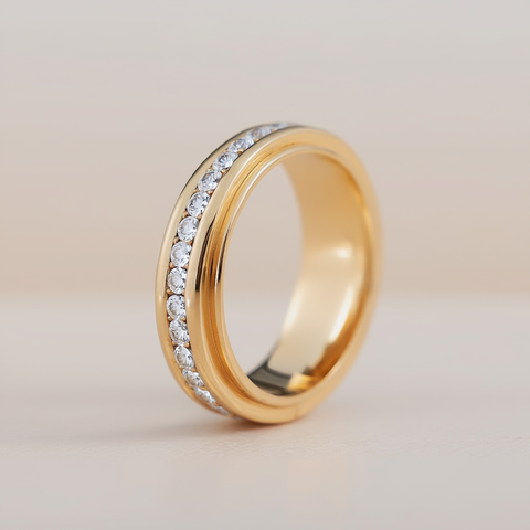 Gold ring with embedded diamonds on a light background