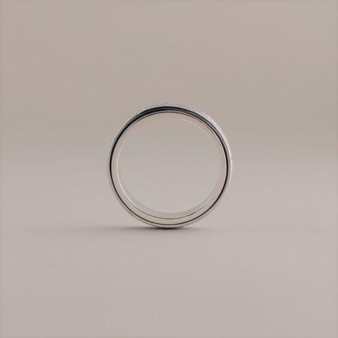 Silver ring on a beige background