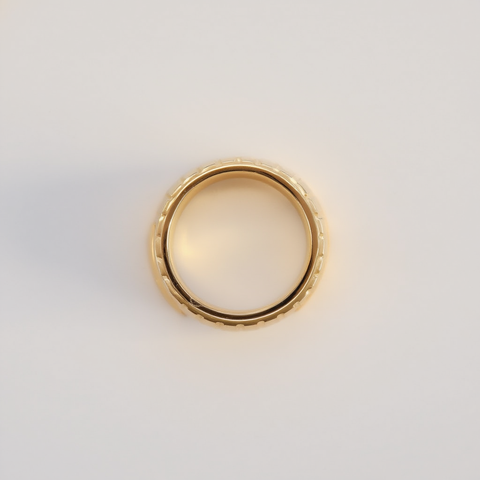 Gold ring on a light gray background