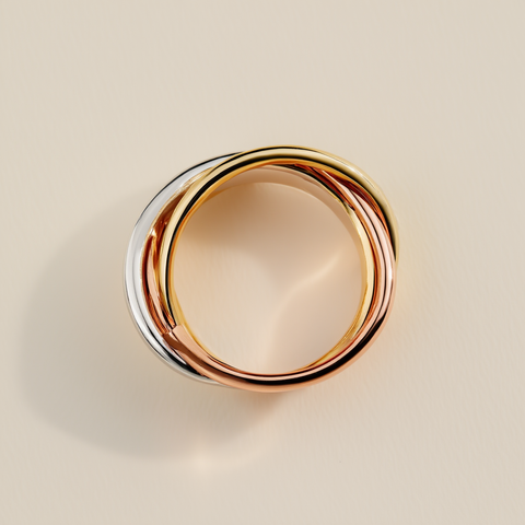 Gold ring with a beige background