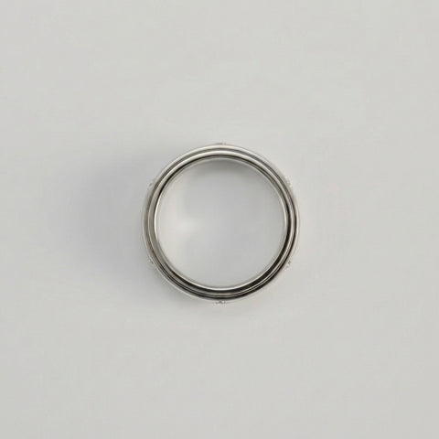 Metallic ring on a light gray background