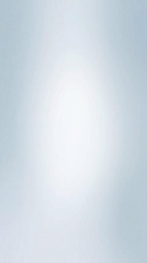 Soft pale blue gradient with a bright centre fading to muted edges