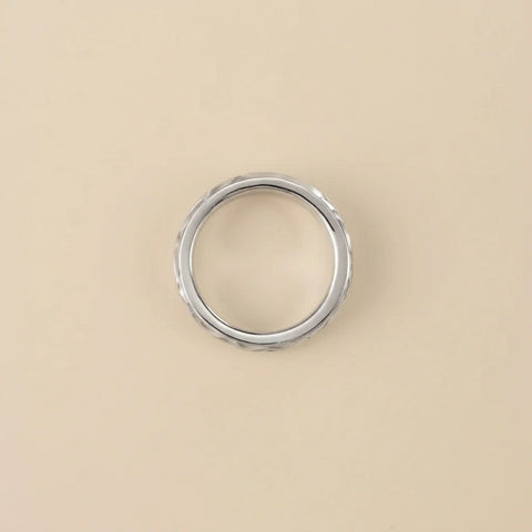 Silver ring on a beige background